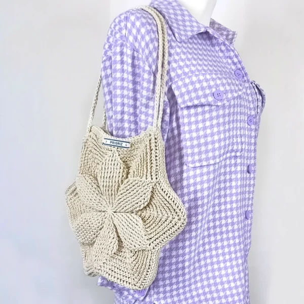 a mannequin wearing a purple and white checkered shirt with a knitted bag PRIGRIZ