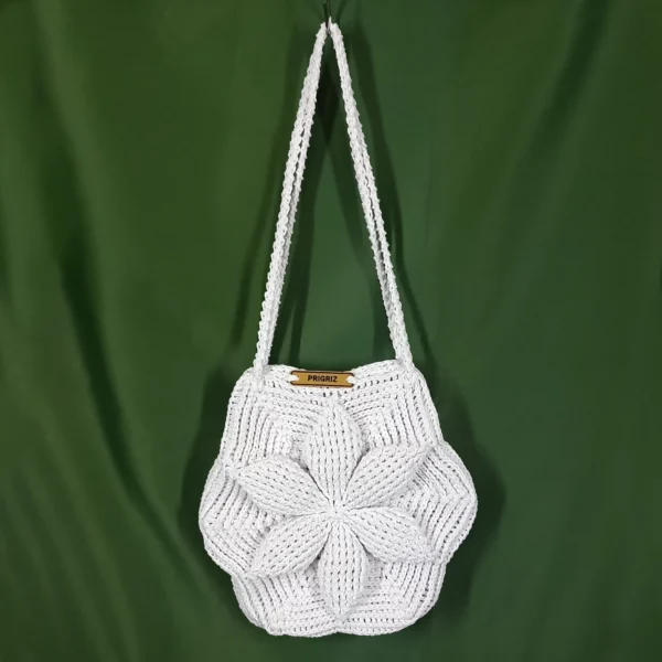 a white knitted bag on a green background PRIGRIZ